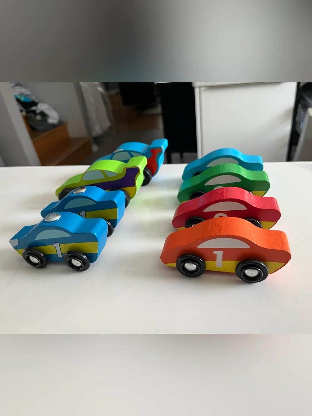 8 wooden racing cars.   Cars Number 1-4 are Melissa & Doug.